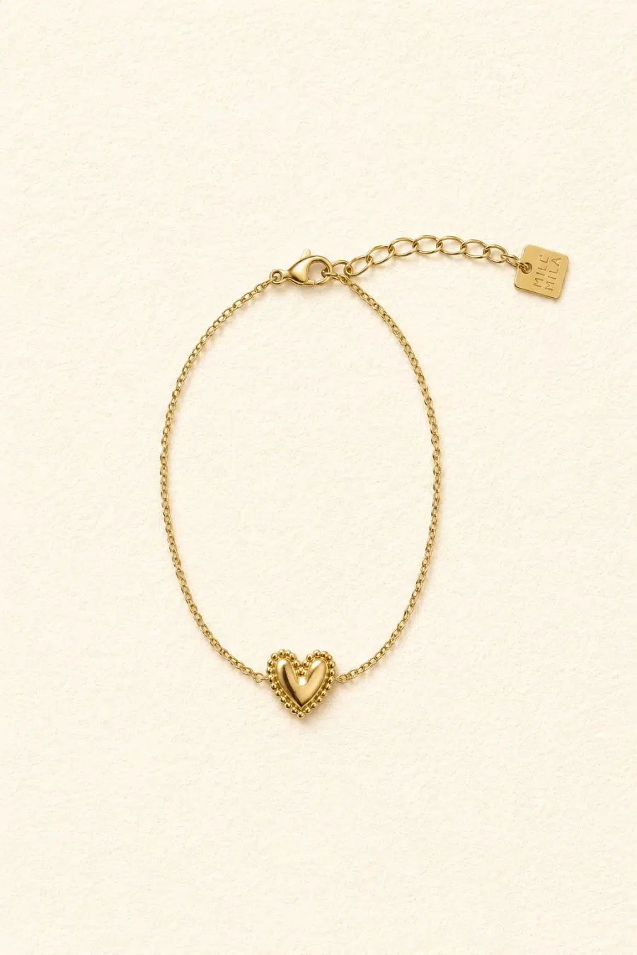 Bracelet à chaîne fine et médaillon forme coeur doré